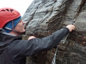 Placing gear on Pine Crag Wall